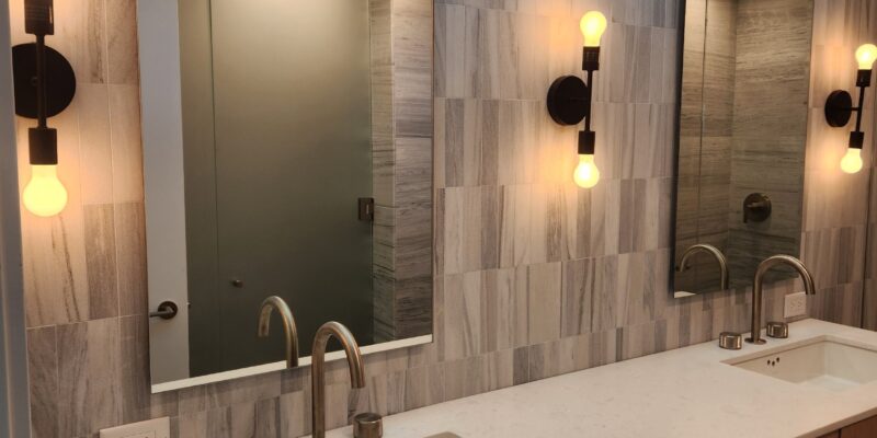Frameless Vanity Mirror over Dual Sink in Coastal Bathroom