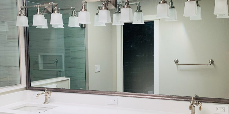 Custom Framed Mirror Designed to Match Home Décor. Installed by Lemon Bay Glass.